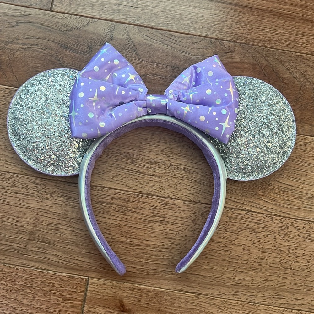 Gently used Disney Parks Tomorrowland Silver Minnie Ears with Purple Bow
